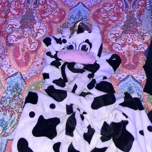 A adult cow onesie costume for Halloween